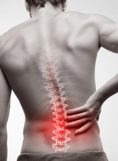 Man holding his lower back in pain